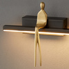 Lampa ścienna AMICI LED 31 cm - czarny kinkiet ze złotą figurą