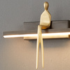 Lampa ścienna AMICI LED 31 cm - czarny kinkiet ze złotą figurą